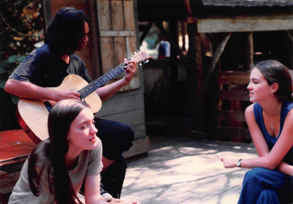 3 campers playing music and singing in 1996